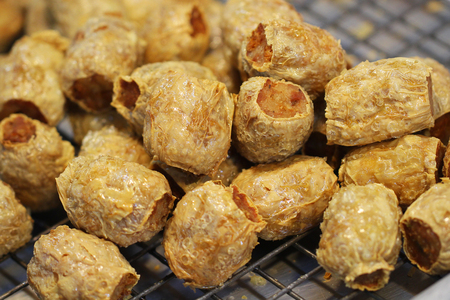 close-up group of organic crab cake ball on aluminum plate at street food restaurant bangkok night marketの写真素材