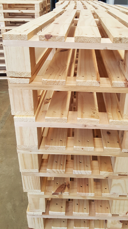 new condition of brown wooden pallets for product distribution and transportation in warehouseの写真素材