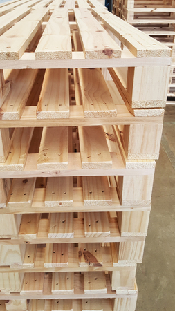 new condition of brown wooden pallets for product distribution and transportation in warehouseの写真素材
