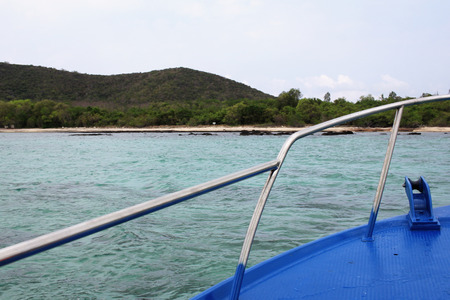 first person view of blue steel moving boat with Seascape and Clear Sky , perspective exploring the ocean, traditional long tail boat, commercial advertisementの写真素材