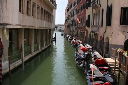 Gondola on Grand Canal Venice surrounding by historical attractive building, Venice, Italy, Commercial advertisement for day trip boat in Europeの写真素材