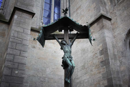 symbols of christianity god in front of Christian church, The mistery sculpture on Famous brick Architectural cathedral church, travel destination backgroundsの写真素材