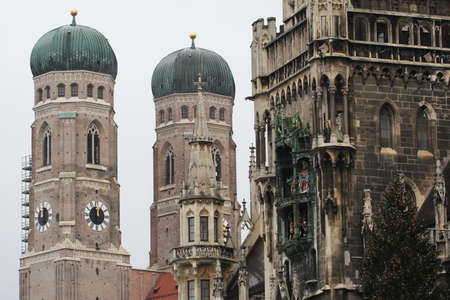 Both onion domes of the Gothic cathedral and city parish church known as the Frauenkirche, Dom zu unserer Lieben Frau, Cathedral of Our Dear Lady, travel destination backgrounds at Munich Germanyの写真素材