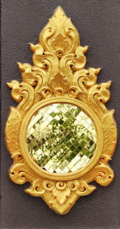 flower statue with metallic reflecting mirror thai style art crafting painted with gold color, gold painting carving sculpture of flower,home decoration poster wallpaper backgroundsの写真素材