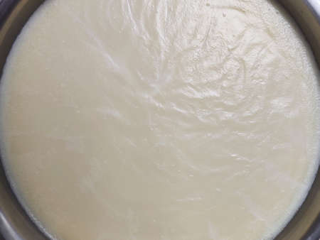 solid oil in stainless deep fryer pot, industrial cooking wax, special oil to fry Doughnut, advertising backgroundsの写真素材