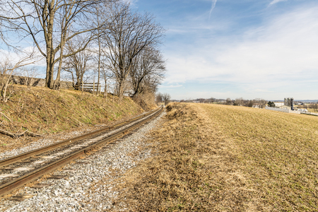 Lonely Rail Road Track on a Winter Day Waiting for a Trainの写真素材