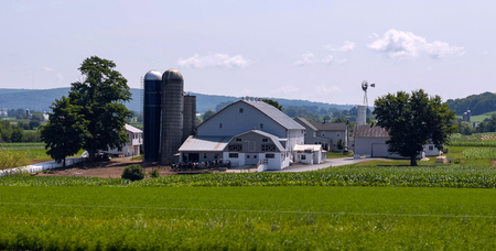 Amish Farm Landscape With Silos on a Sunny Summer Dayの写真素材