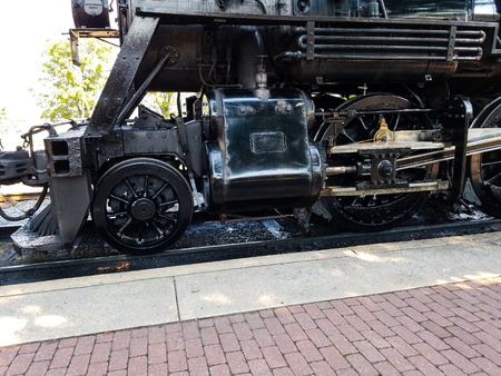 Steam Locomotive Warming up a Train Station on a summer Dayの写真素材