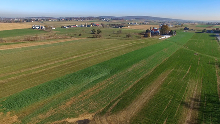 Aerial View of Amish Farm Countryside in Autumn from a Droneの写真素材