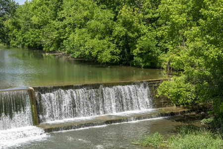 Amish Countryside with a Man Made Waterfall by a Millの写真素材