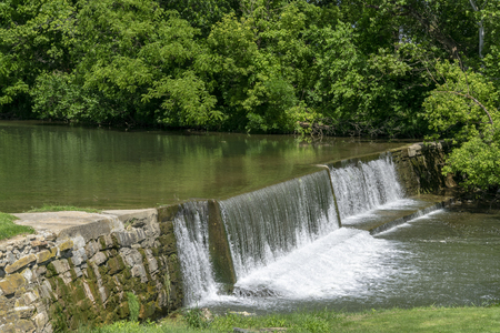 Amish Countryside with a Man Made Waterfall by a Millの写真素材