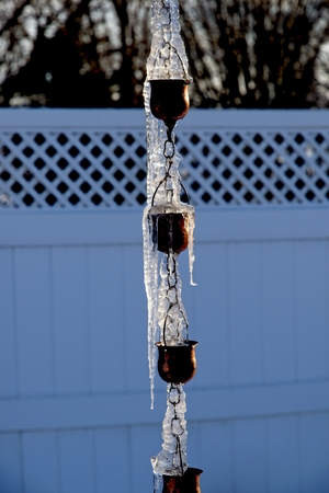 A Frozen Rain Drain in Winterの写真素材