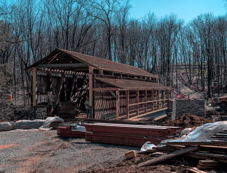 Restoring Burr Arch Covered Bridge as Seen on a Spring Dayの写真素材