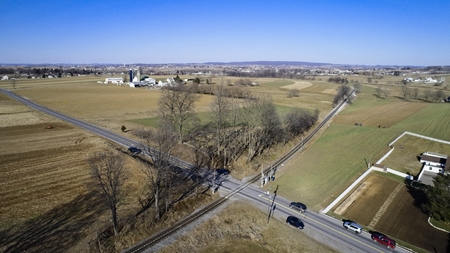Aerial View of Amish Farmlands by Rail Road Tracksの写真素材