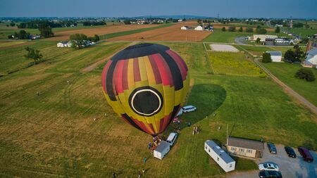 Aerial View of Hot Air Balloons Trying to Launch in a Wind as Seen by a Droneの写真素材