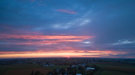 An Aerial View of a Sunset with Red and Blues on a Summer Nightの写真素材