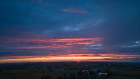An Aerial View of a Sunset with Red and Blues on a Summer Nightの写真素材