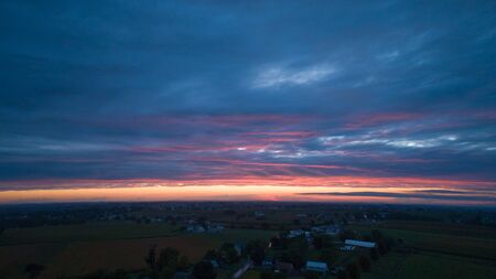 An Aerial View of a Sunset with Red and Blues on a Summer Nightの写真素材