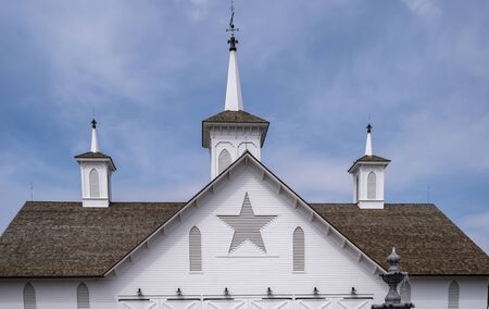 View of a Steeple Cupolas with a Weather Vane on a Sunny Summer Dayの写真素材