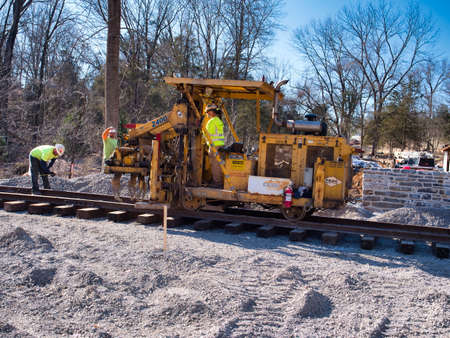 Restoring an Old Railroad Train Track on an Old Right of Wayの写真素材