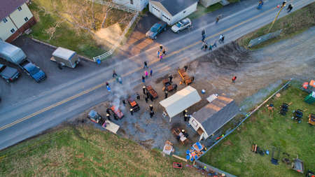 Aerial View of an Amish Mud Sale with Lots of Buggies and Farm Equipment on a Early Morning Winter Dayの写真素材