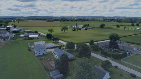 Aerial View of Green Farmlands With Different Crops Growing in the Fields on a Sunny Dayの写真素材