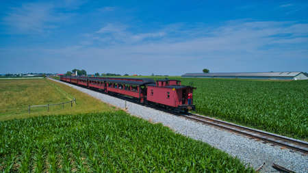 Aerial View of Thomas the Tank Engine Approaching Thru Trees and Farmlands Pulling Passenger Cars...
