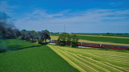 Ronks, Pennsylvania,June 2019 - Aerial View of Thomas the Tank Engine Approaching Thru Trees and...