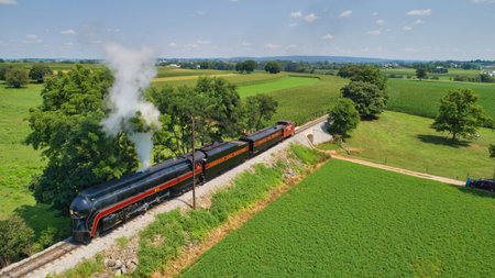 Ronks, Pennsylvania, July 23, 2022 - Drone View of an Antique Steam Engine, Approaching, Blowing...