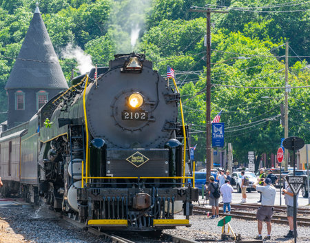 Ronks, Pennsylvania, November 8, 2021 - A View of a Restored Steam Freight Train Blowing Smoke and...