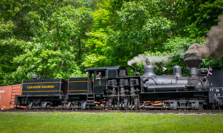 Cass, West Virginia, June 18, 2022 - A View of an Antique Shay Steam Engine Warming Up, Blowing Smoke and Steam on a Sunny Dayのeditorial素材