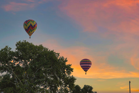 Morning Sunrise Launch Of Hot Air Balloons During a Balloon Festival on Summer Dayの写真素材