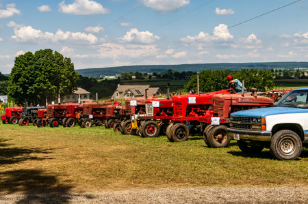 Kinzers, Pennsylvania, August 18, 2022 - View of Steam and Tractor Event with Antique Tractors of all Types on a Sunny Summer Dayのeditorial素材