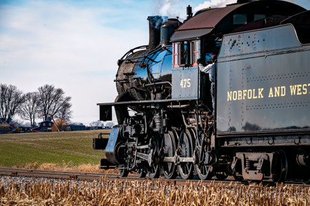 Ronks, Pennsylvania, December 28, 2022 - A Rear Close Up View of a Classic Steam Locomotive Traveling Thru the Countrysideのeditorial素材
