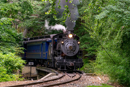 Wilmington, Delaware, August 8, 2021 - A View of a Steam Passenger Train Approaching around a Curve...