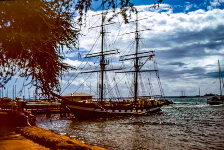 Lahaina, Maui, Hawaii, June 2, 1989 - Old Slide of Whaling Ship, The Carthaginian in Lahaina Harbor, Tied to Coral Pier, on a Beautiful Sunny Summer Dayのeditorial素材