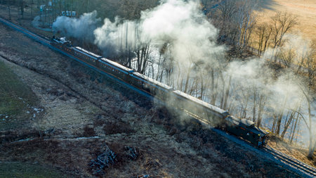 Rockhill Furnace, Pennsylvania, February 19, 2023 - An Aerial View of a Restored Narrow Gauge Steam Passenger Train Traveling With a Full Head of Steam on a Sunny Winter Dayのeditorial素材