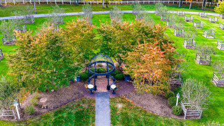 Elizabethtown, Pennsylvania, October 22, 2023 - An Aerial View of a Iron Gazebo in the Center of an Orchard on an Autumn Dayのeditorial素材
