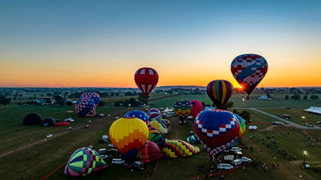 Bird in Hand, Pennsylvania, September 17, 2023 - An Aerial View of Multiple Hot Air Balloons Floating Up During a Morning Launch on a Sunny Summer Dayのeditorial素材