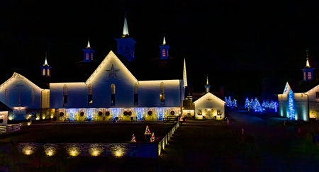 Elizabethtown, Pennsylvania, December 6, 2022 - A Drone View of a Large Drive Thru Christmas Display, With Lots of Colored Lights, Trees, and Landscapes on Open Meadows and Building on a Clear Nightのeditorial素材