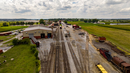 Strasburg, Pennsylvania, August 15, 2023 - The heart of agricultural logistics beats in this rustic rail depot, where a series of tracks and trains intermingle with the vast expanse of farmlands.のeditorial素材