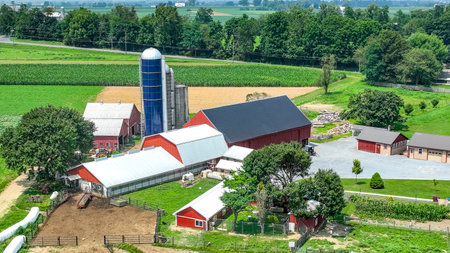 Paradise, Pennsylvania, USA, July 18. 2023 - An Aerial View of a Farmstead with Barns and Green Fieldsのeditorial素材