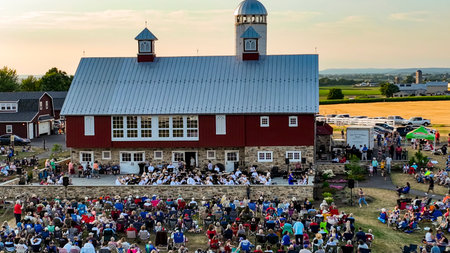 Ronks, Pennsylvania, USA, July 3, 2024 - Outdoor Orchestra Performing In Front Of A Red Barn With A...