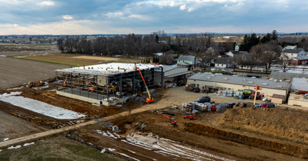 Construction Activity Underway on a New Facility in a Rural Area With Machinery at Work During Late Afternoon Hours. High quality photoの写真素材