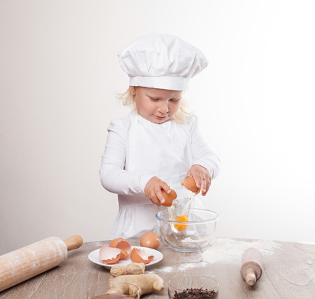 young pastry chef egg splitsの写真素材