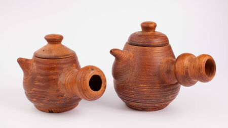 earthenware teapots isolated on whiteの写真素材