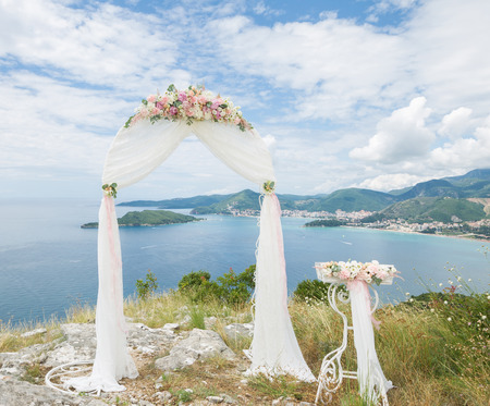 wedding arch and a table on a hill overlooking the seaの写真素材