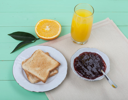light breakfast with juice and toasts