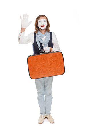 mime actor with orange suitcase someone welcomesの写真素材
