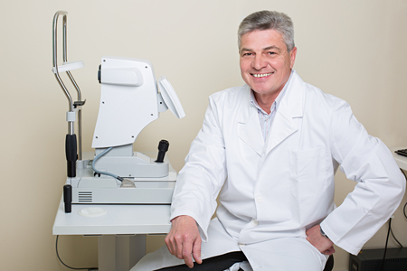 Optometry concept -  portrait of handsome elderly eye doctorの写真素材